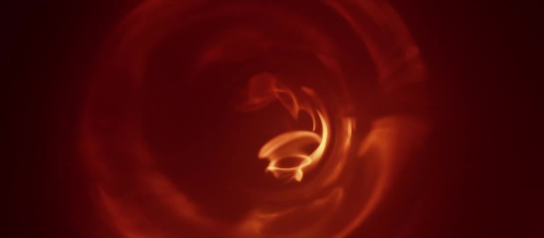 A swirling flame burning in the dark