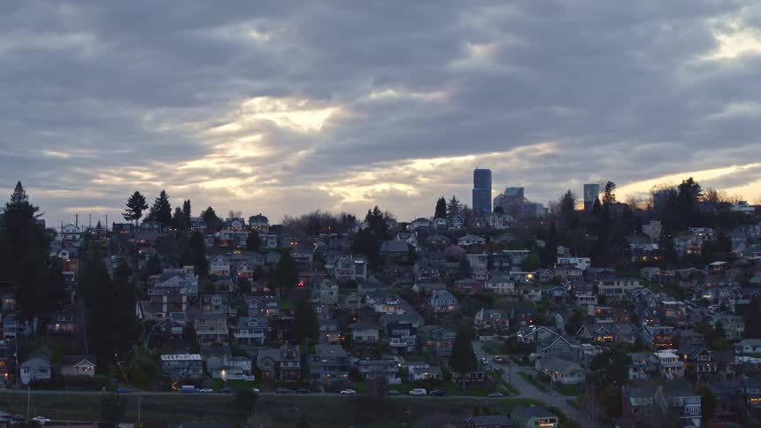 Rising over the Leschi neighborhood to reveal SoDo and downtown Seattle at dusk