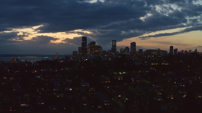 Evening orbit around the Central District and downtown Seattle as the sunset sky peeks through the clouds