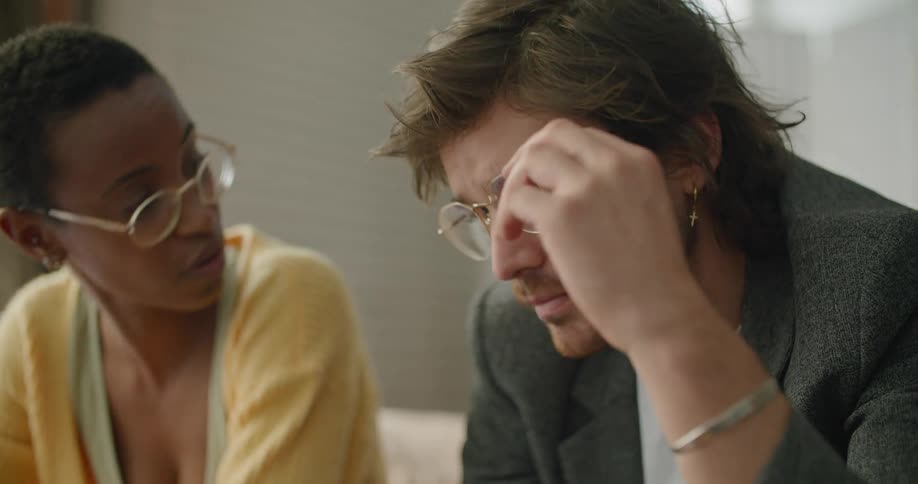 Two people are working and talking together