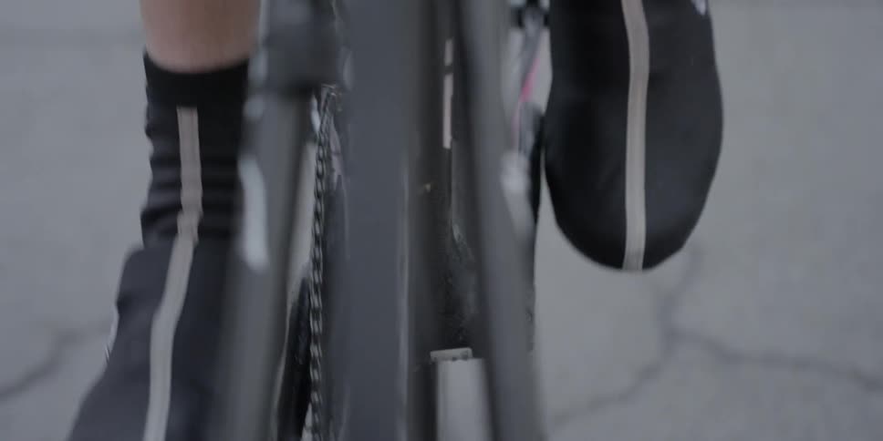 Close up of feet pedaling a bike
