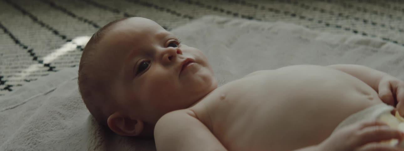 A baby is moving around on the ground