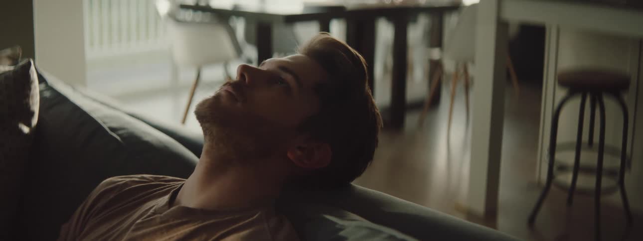 A man resting on a couch