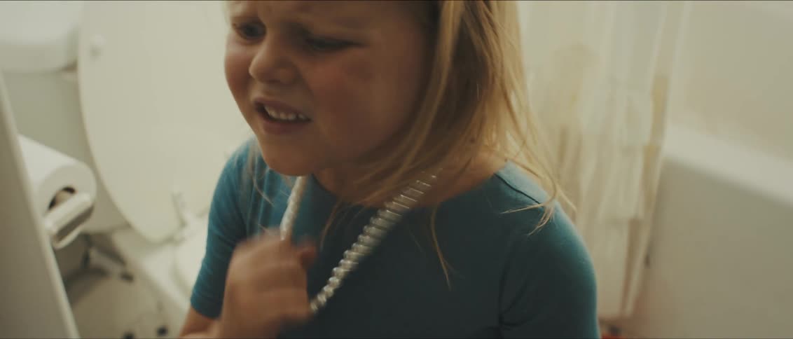 A girl breaking a necklace off of her neck