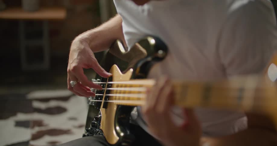A man plays the guitar