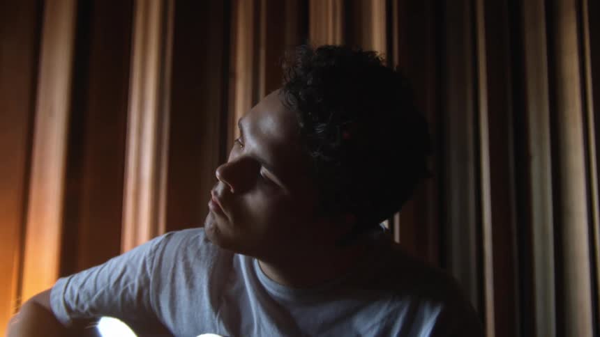 A man is playing the guitar
