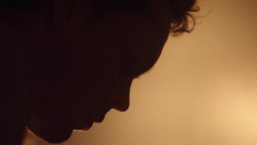 A man is moving in the dark room