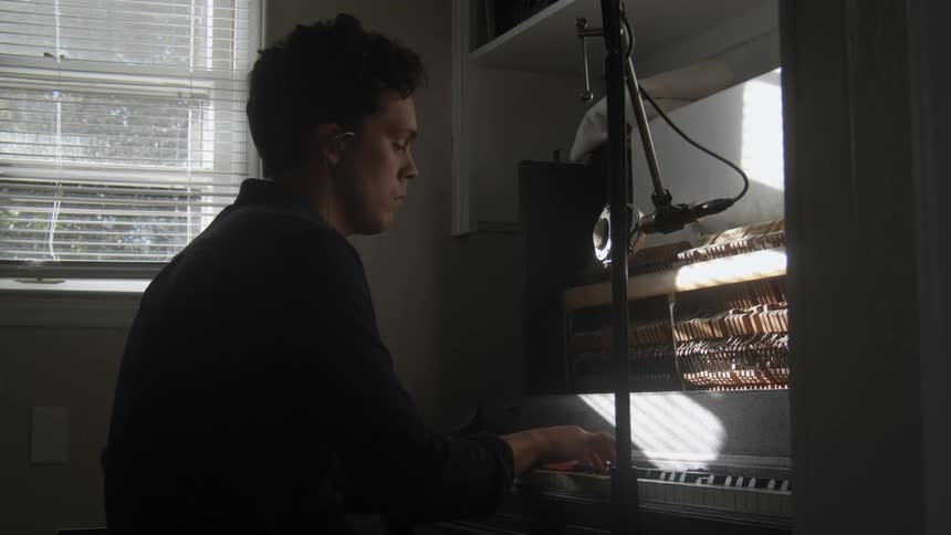 A man plays a keyboard