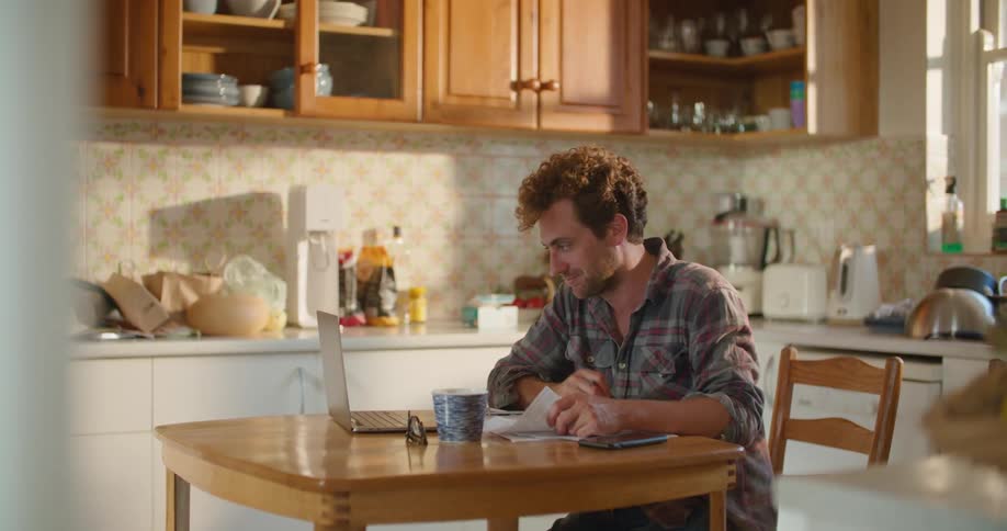 Male talking in kitchen