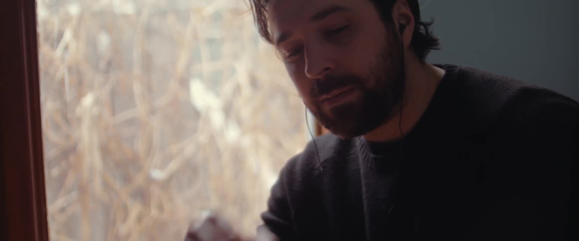 A man sitting and thinking looking stressed