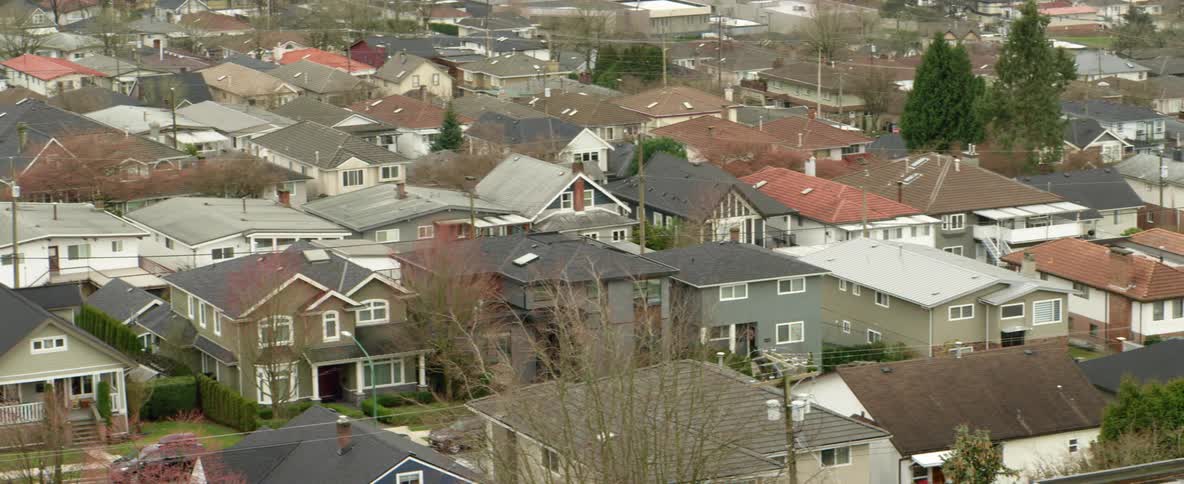 Aerial view of houses in a suburb is displayed in spring