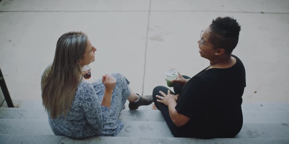 Friends talking on stairs