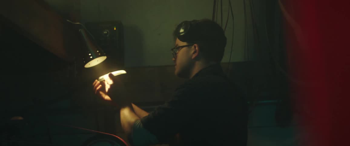 Male inspecting an item