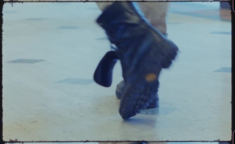 A person is walking down the hall