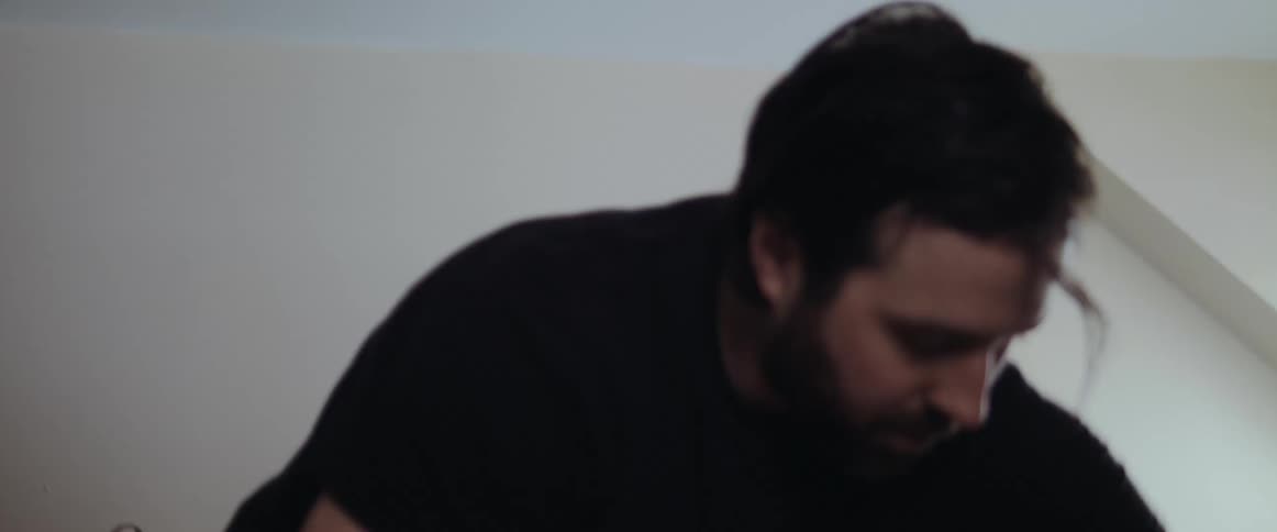 A man is making his bed