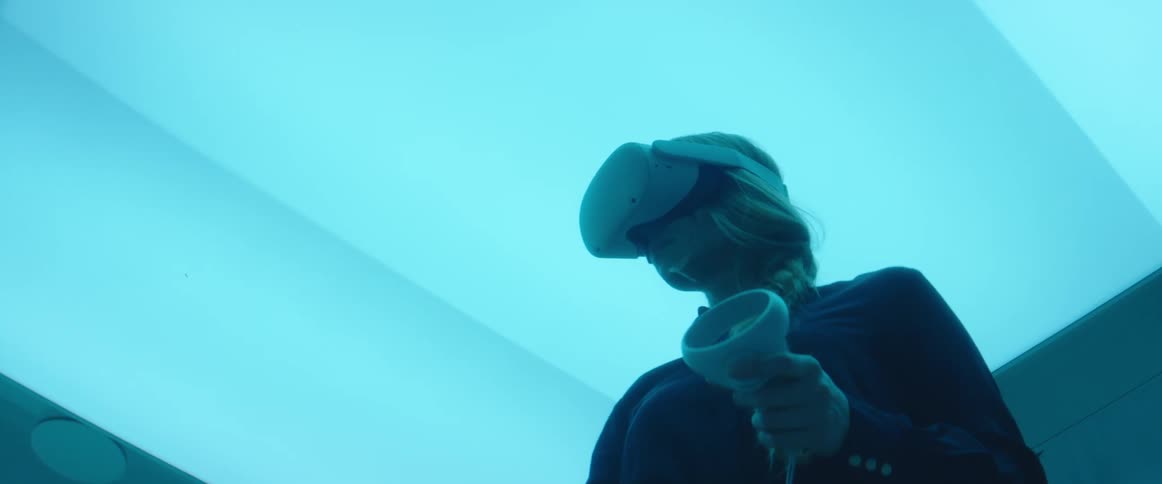 A woman playing a game with vr controllers