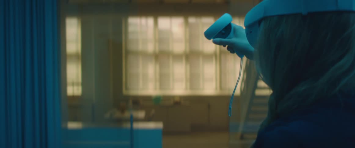 An employee sanitizing a room