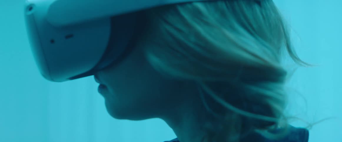 A woman is using a virtual reality headset