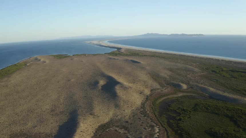 An aerial view of a landscape with the water and coast
