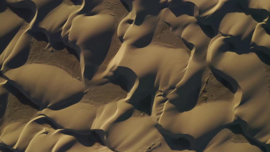 Black gray and brown colors that look like sand dunes in a desert