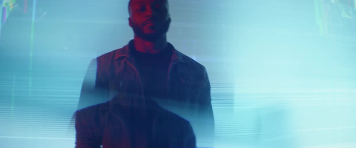 A man is posing in flickering lights