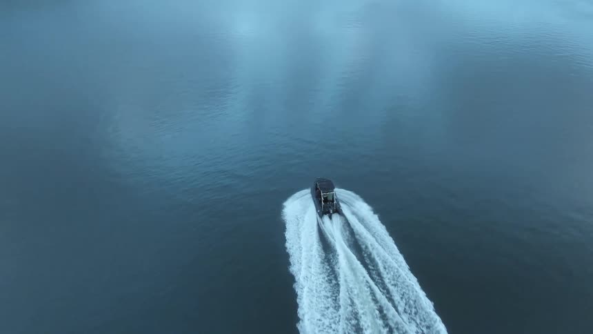An aerial view of a boat on a lake