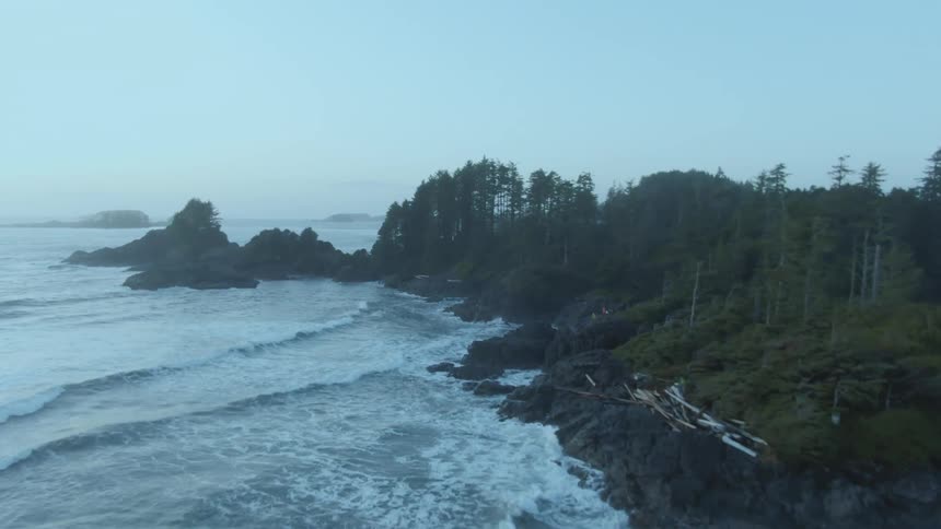 The waves crash against the shore