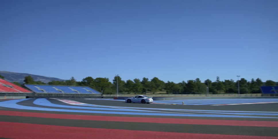 A racing car taking laps around the circuit