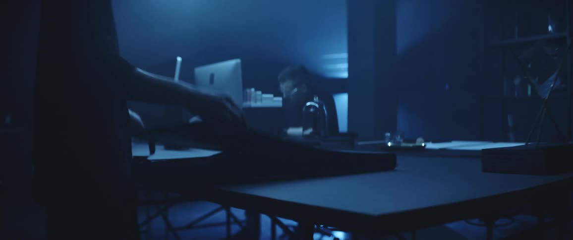 Two co workers working on something at a table
