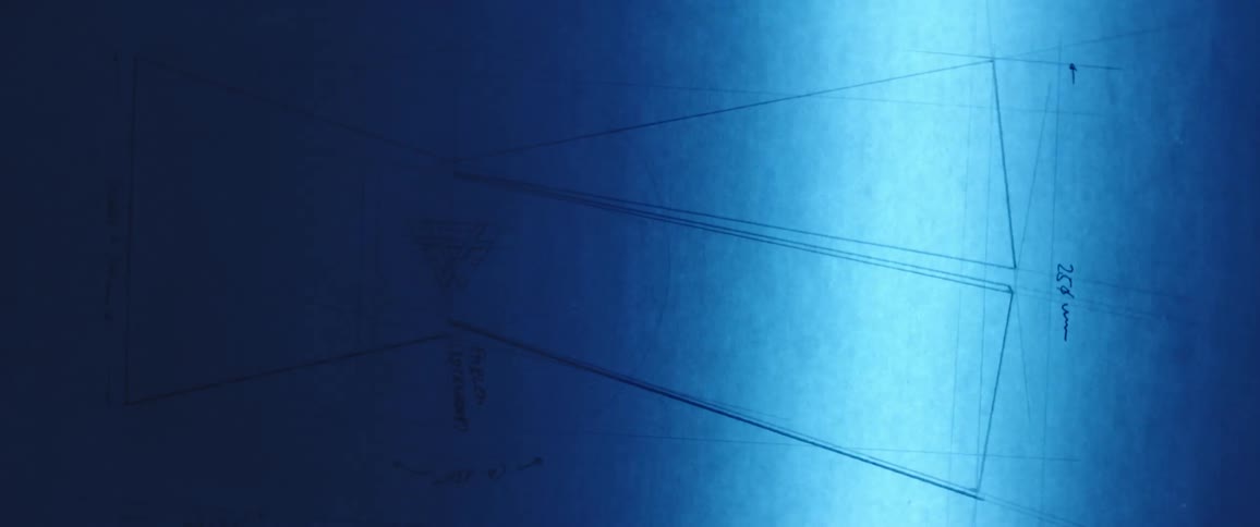 Blue light from scanner passes over line diagram with noted dimensions
