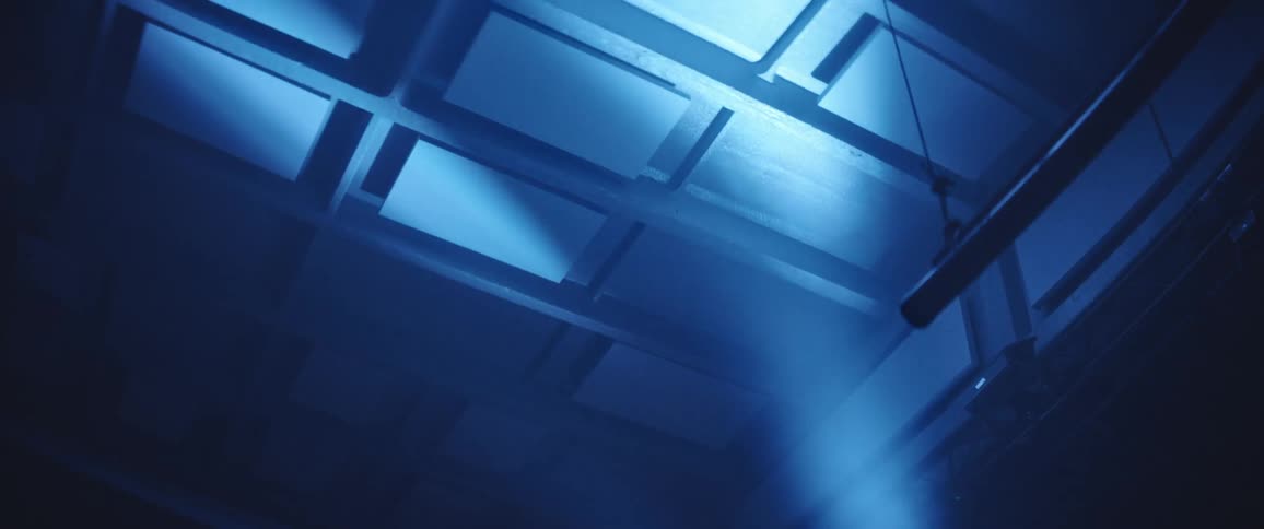 A room with spotlights shining off the ceiling