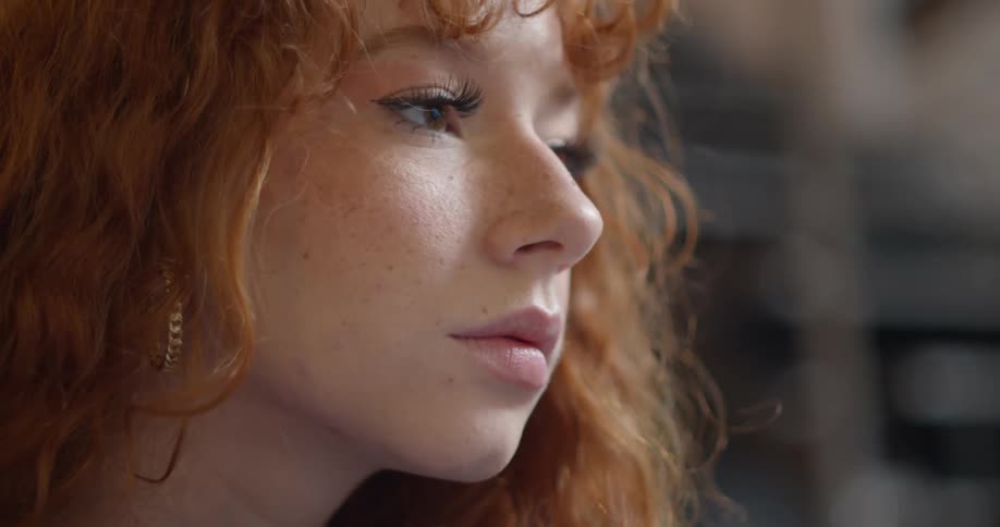 A woman with earrings in a room