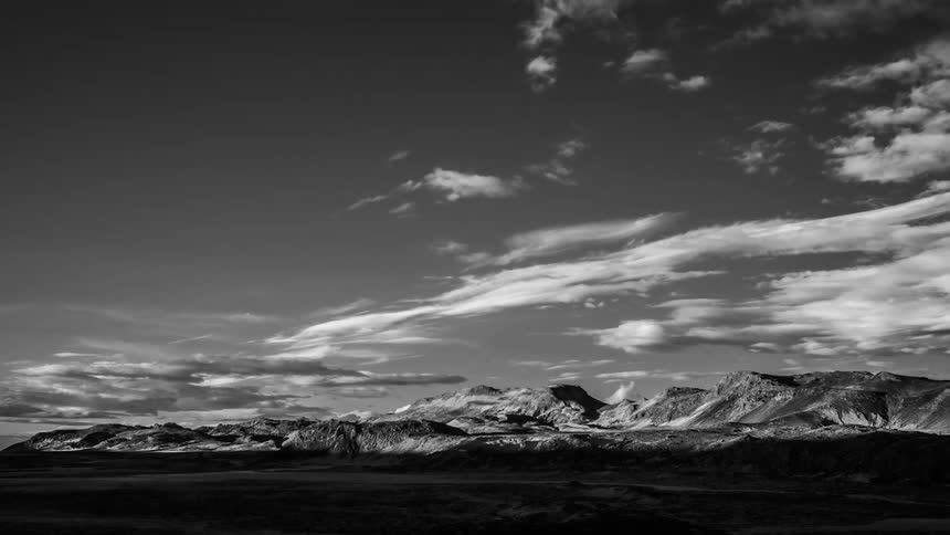 Clouds moving across a mountain range