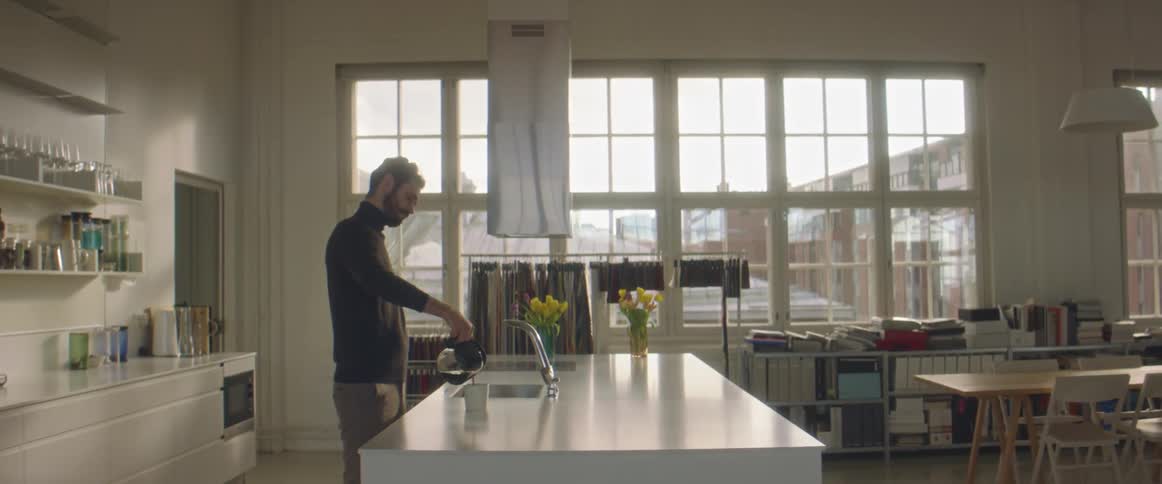 A man fills his coffee pot