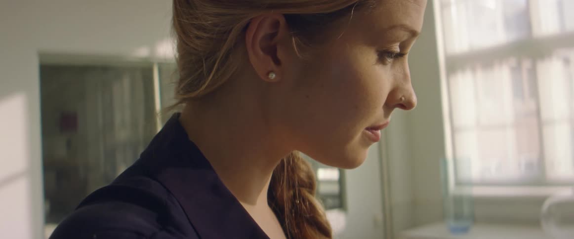 A woman is talking to someone in the office