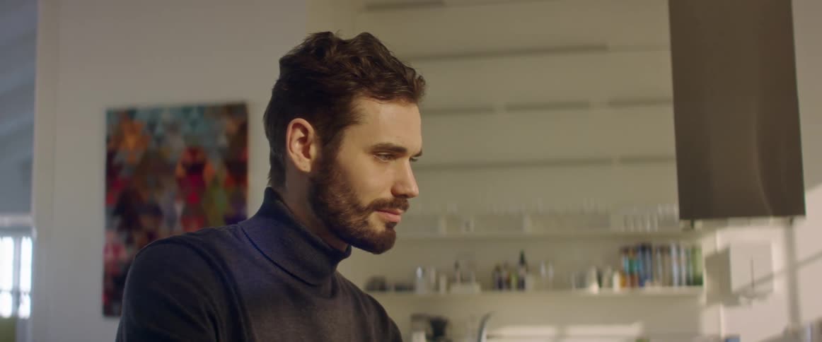 A man standing in a room talking