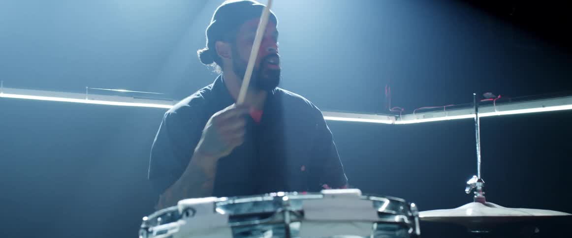 A man plays the drums