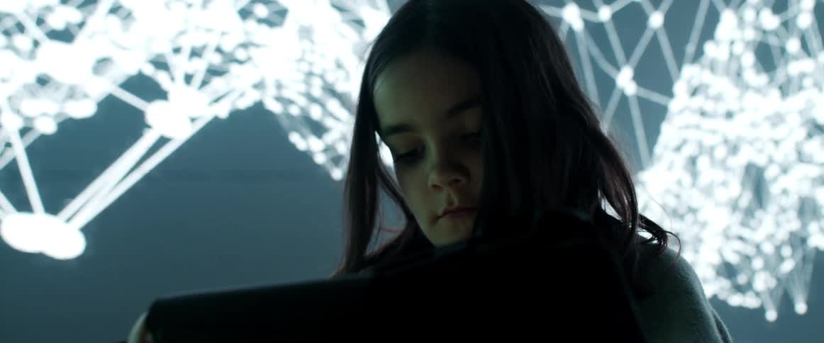 A girl using a tablet in a room