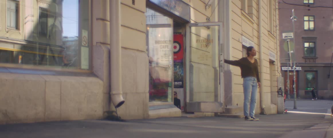 Owner opens the door of a shop in the city downtown