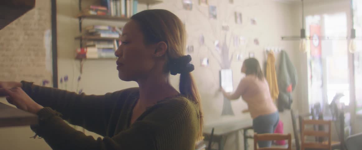 Two women decorating a room
