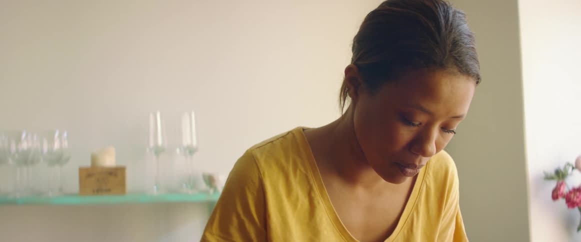 Close up of the face of a woman working at home