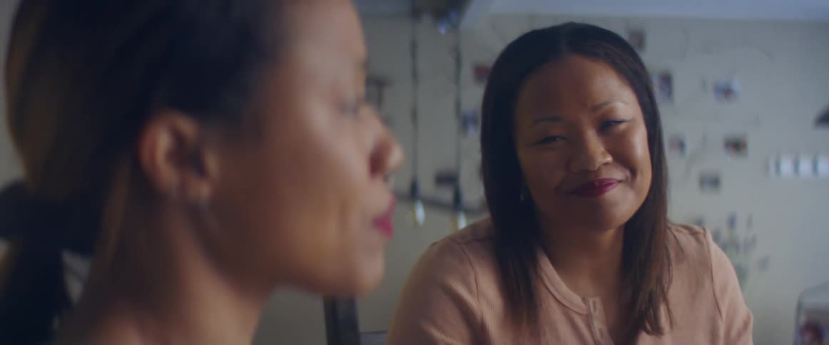 Two women talking with each other