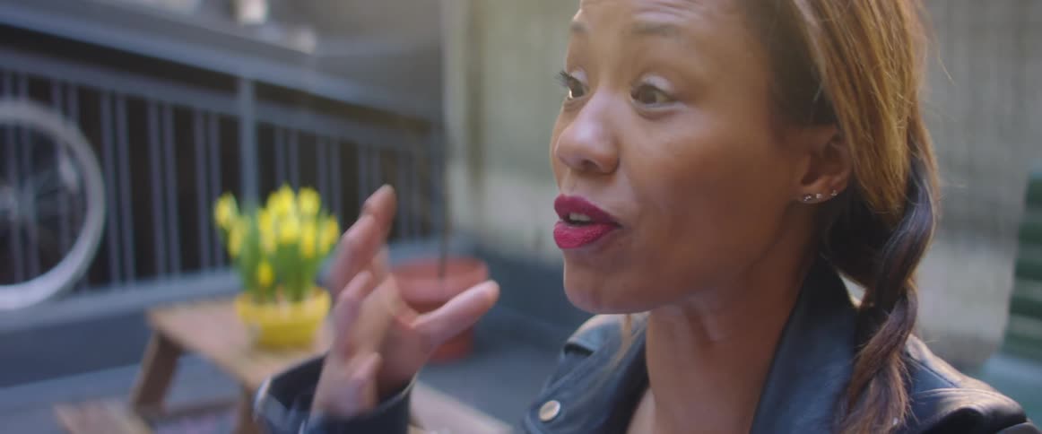 A woman talking to someone outside