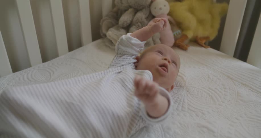 A child stretching and waking up