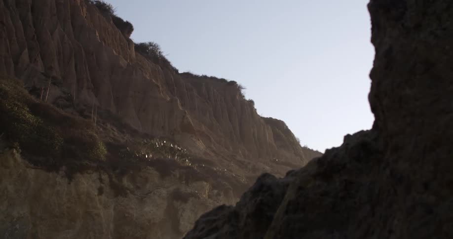 View of a large mountain cliff on a sunny day