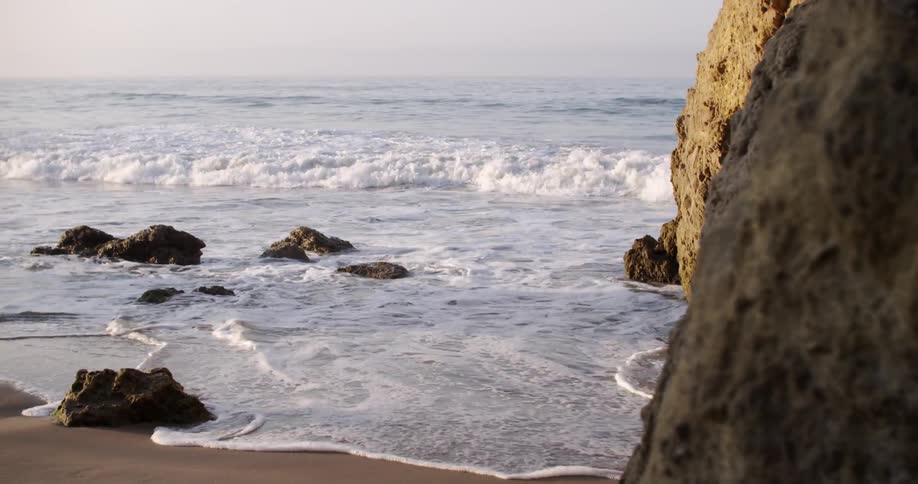 Waves coming ashore on a rocky beach