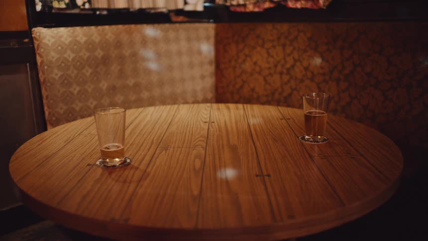 An empty table at a restaurant is displayed