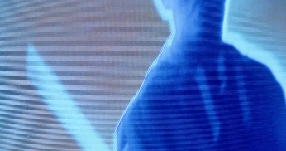 A shadow of a man is on digital display