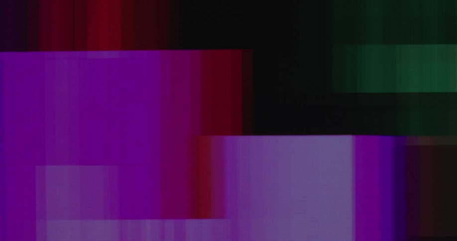 Colorful blocks and pixels move across black background