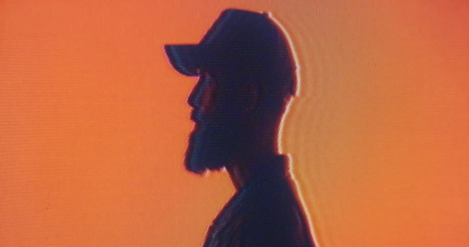 A screen with a fuzzy image of a man on it